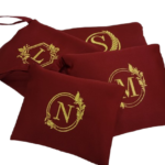 Pouch bags with embroidered letters